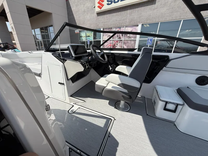 Slide: The Image of 2025 Yamaha Boats AR250 interior with modern dashboard and seating. - 44