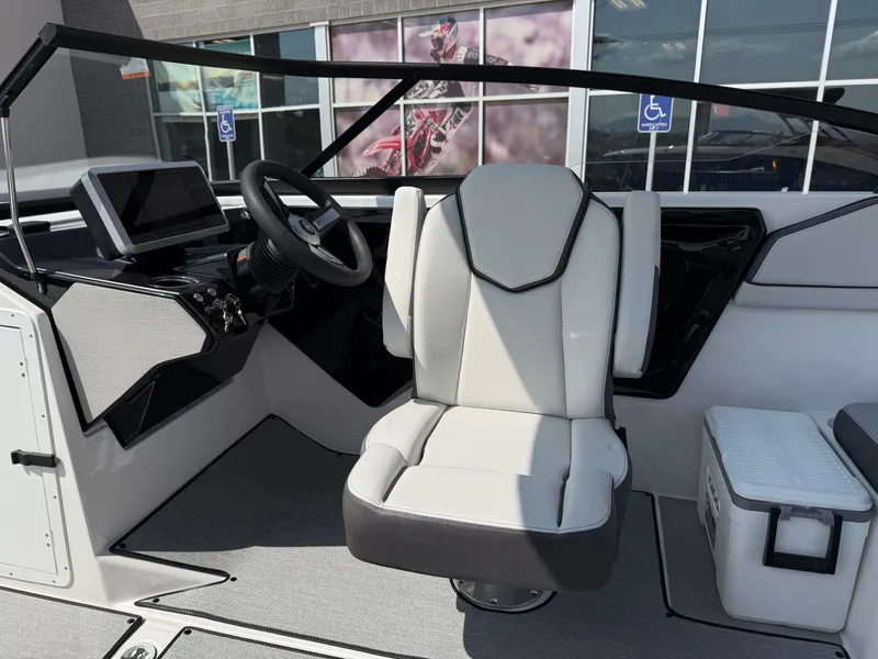 Slide: The Image of 2025 Yamaha Boats AR250 cockpit with modern steering and seating. - 45