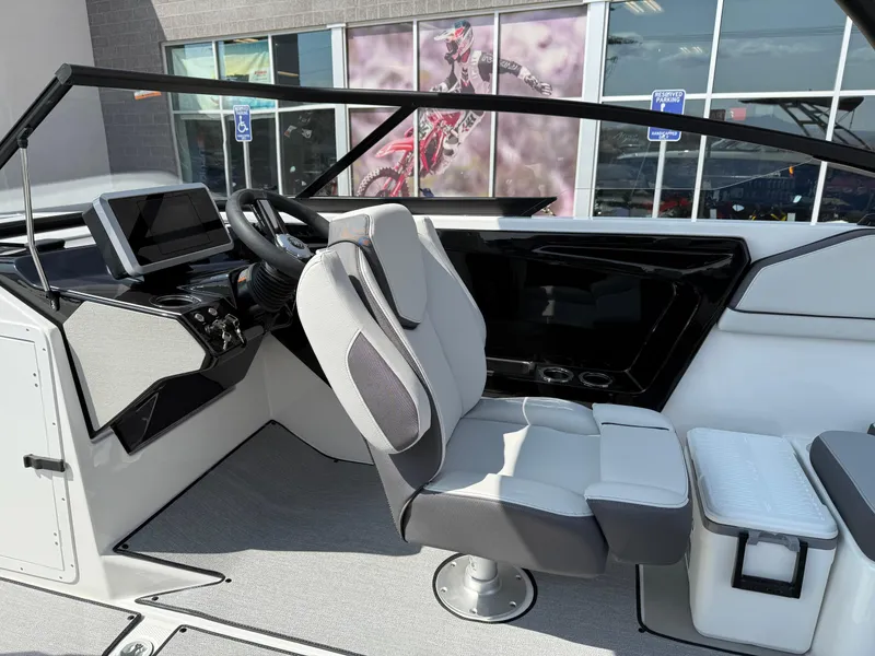 Slide: The Image of 2025 Yamaha Boats AR250 cockpit with modern controls and seating. - 46