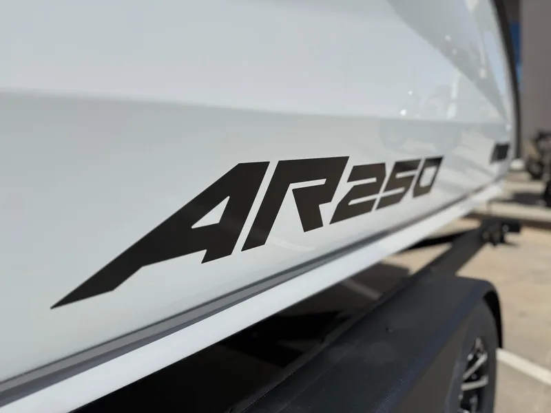 Slide: The Image of 2025 Yamaha Boats AR250 logo on sleek white hull. - 13