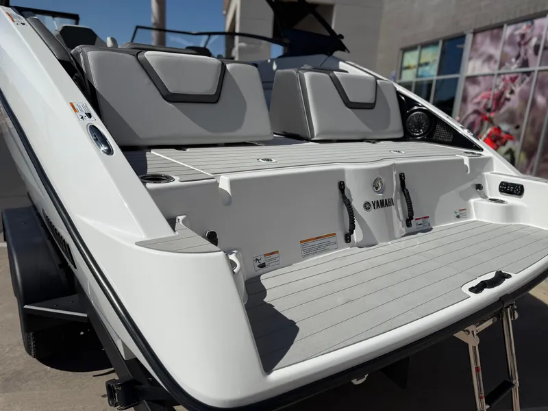Slide: The Image of 2025 Yamaha Boats AR250, rear view showcasing seating and swim platform. - 16