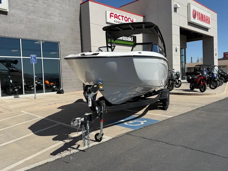 Slide: The Image of 2025 Yamaha Boats AR250 displayed outside dealership, parked on a trailer. - 21