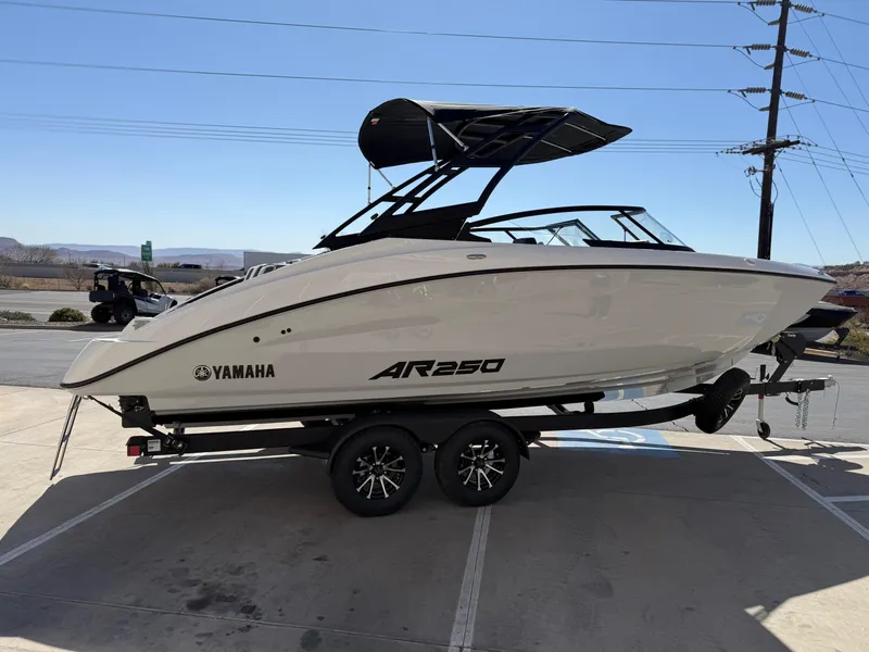 Slide: The Image of 2025 Yamaha Boats AR250 on trailer, sleek design, parked outdoors. - 3