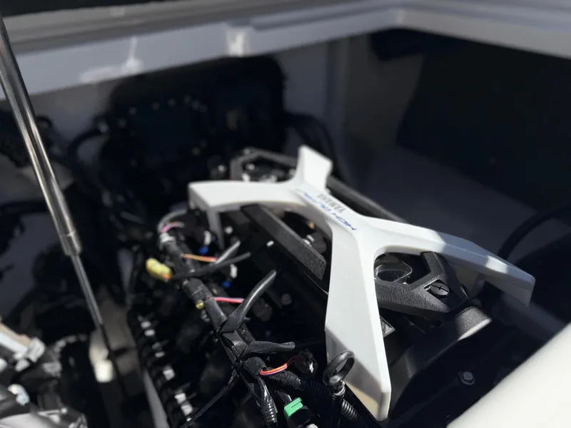 Slide: The Image of 2025 Yamaha Boats AR250 engine compartment, showcasing intricate mechanical components. - 37