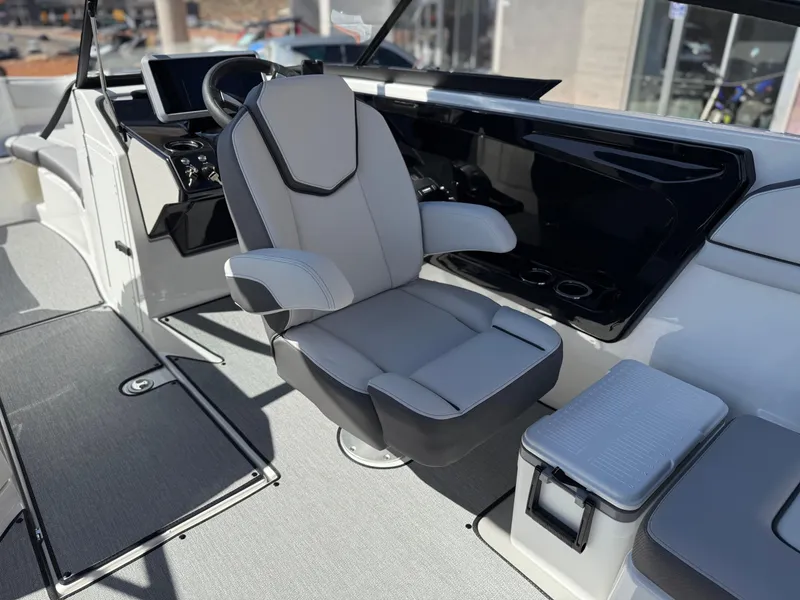 Slide: The Image of 2025 Yamaha Boats AR250 interior with sleek captain's chair and modern dashboard. - 42