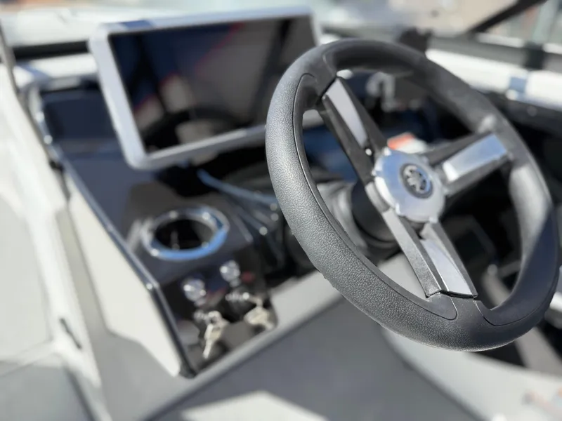 Slide: The Image of 2025 Yamaha Boats AR250 steering wheel and dashboard close-up. - 45