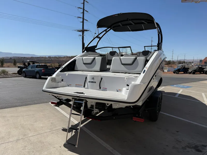 Slide: The Image of 2025 Yamaha Boats AR250 on trailer, rear view with swim platform and ladder. - 5