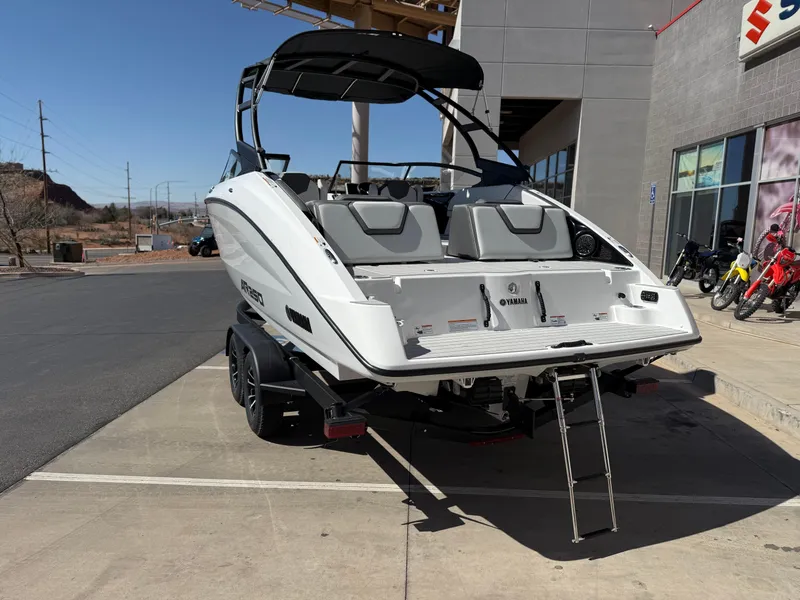 Slide: The Image of 2025 Yamaha Boats AR250 on trailer, rear view with ladder extended. - 7