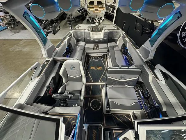 Slide: The Image of 2025 Tigé 25ZX boat interior with modern seating and advanced dashboard design. - 15