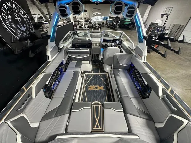 Slide: The Image of 2025 Tigé 25ZX boat interior with sleek seating and advanced audio system. - 6