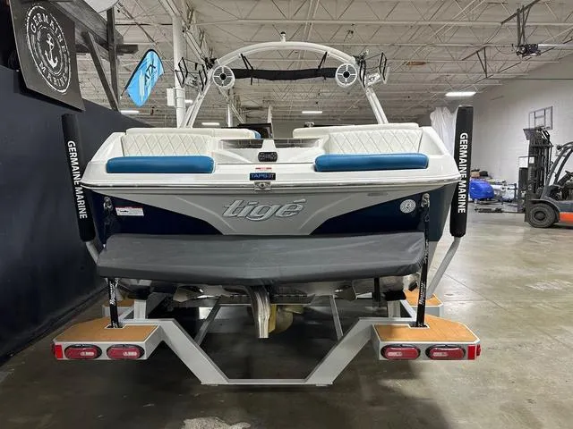 Slide: The Image of 2022 Tigé Z1 boat in showroom, rear view with branding and equipment. - 5