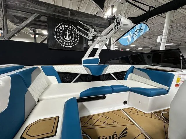 Slide: The Image of 2022 Tigé Z1 boat interior with blue and white seating, displayed at Germaine Marine. - 9