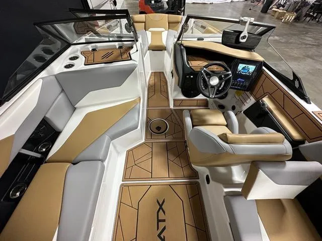 Slide: The Image of 2023 ATX Boats 22 TYPE-S interior with tan and white seating, modern dashboard, and sleek design. - 11