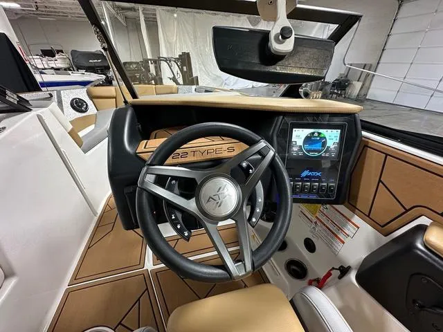 Slide: The Image of 2023 ATX Boats 22 TYPE-S dashboard with steering wheel and digital display. - 14