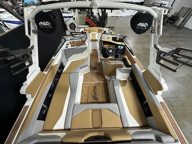 Slide: The Image of 2023 ATX Boats 22 TYPE-S interior with tan and gray seating, modern dashboard, and spacious layout. - 8