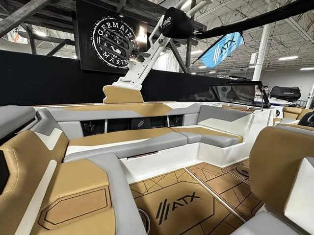 Slide: The Image of 2023 ATX Boats 22 TYPE-S interior with tan and gray seating, showcased indoors. - 9
