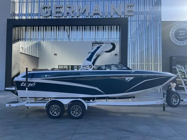 Slide: The Image of 2025 Tigé Z3 boat on trailer outside Germaine dealership. - 1