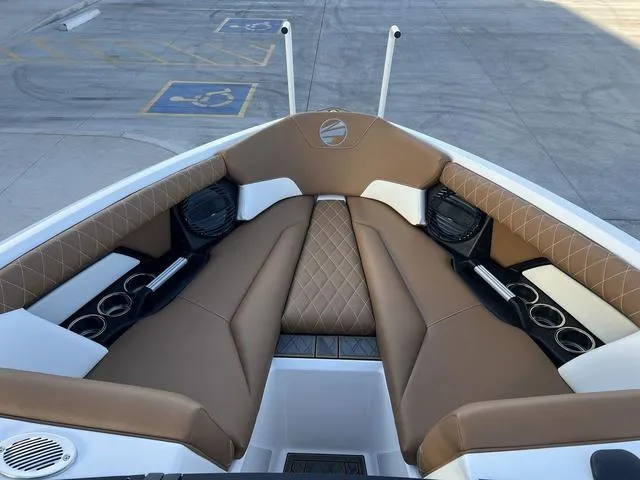 Slide: The Image of 2025 Tigé Z3 boat interior with brown leather seating and cup holders. - 11
