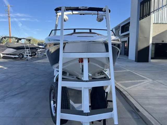 Slide: The Image of 2025 Tigé Z3 boat on trailer, parked outdoors near a building. - 3