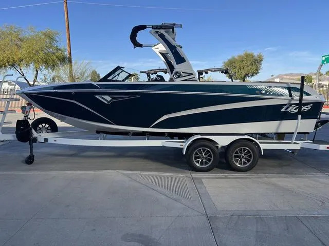 Slide: The Image of 2025 Tigé Z3 boat on trailer, sleek design, parked outdoors. - 5