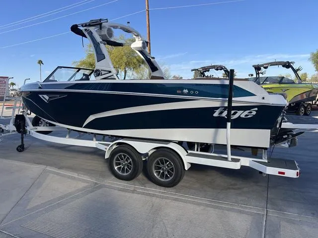 Slide: The Image of 2025 Tigé Z3 boat on trailer, sleek design, parked outdoors. - 6