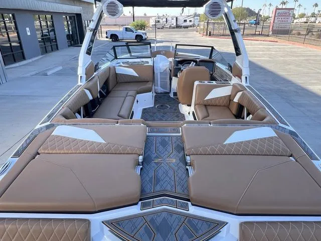 Slide: The Image of 2025 Tigé Z3 boat interior with luxurious brown seating and modern design. - 9