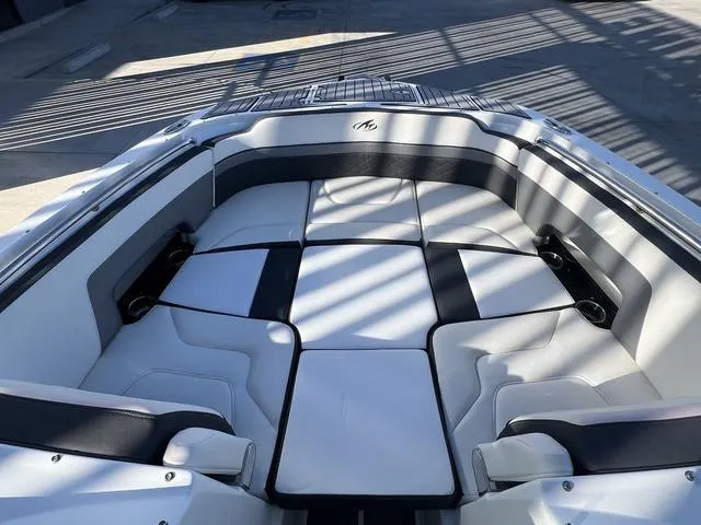 Slide: The Image of Luxurious seating area on a 2020 Monterey MX6 SURF boat, featuring sleek, modern design. - 10