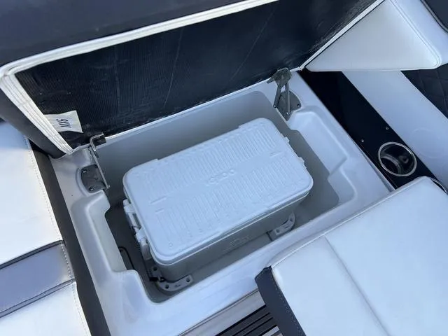 Slide: The Image of 2020 Monterey MX6 SURF boat with built-in cooler storage compartment. - 14