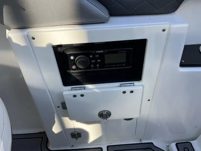 Slide: The Image of Control panel of a 2020 Monterey MX6 SURF boat with audio system. - 16