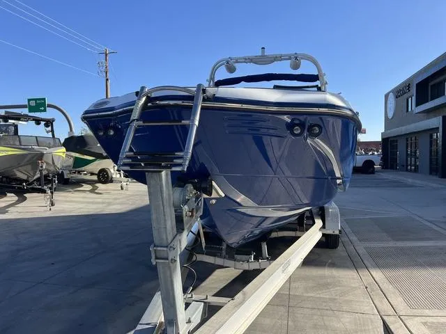 Slide: The Image of 2020 Monterey MX6 SURF boat on trailer, parked outdoors. - 3