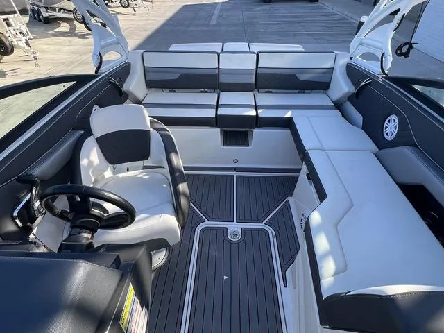 Slide: The Image of 2020 Monterey MX6 SURF boat interior with sleek seating and modern design. - 8