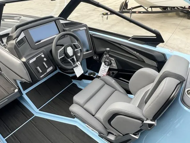 Slide: The Image of 2025 Supra SE 575 boat interior with modern dashboard and comfortable seating. - 11