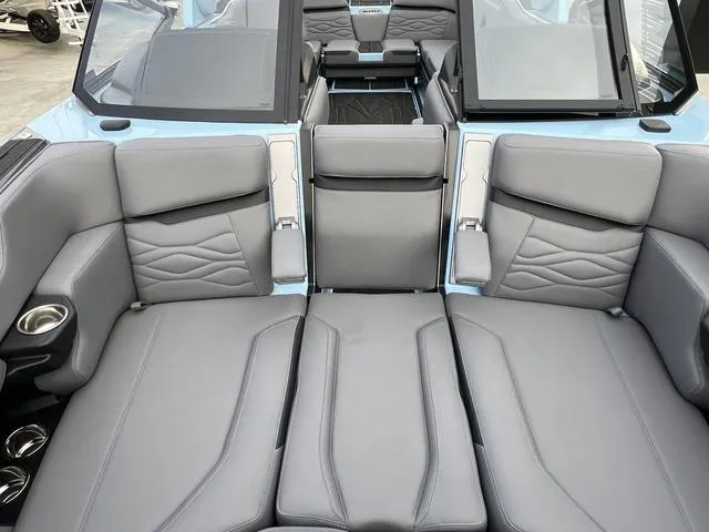 Slide: The Image of 2025 Supra SE 575 boat interior with luxurious gray leather seating. - 12