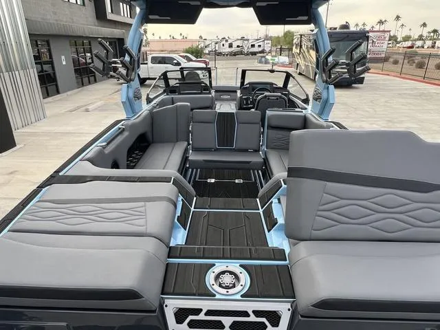Slide: The Image of 2025 Supra SE 575 boat interior with luxurious seating and modern design. - 13