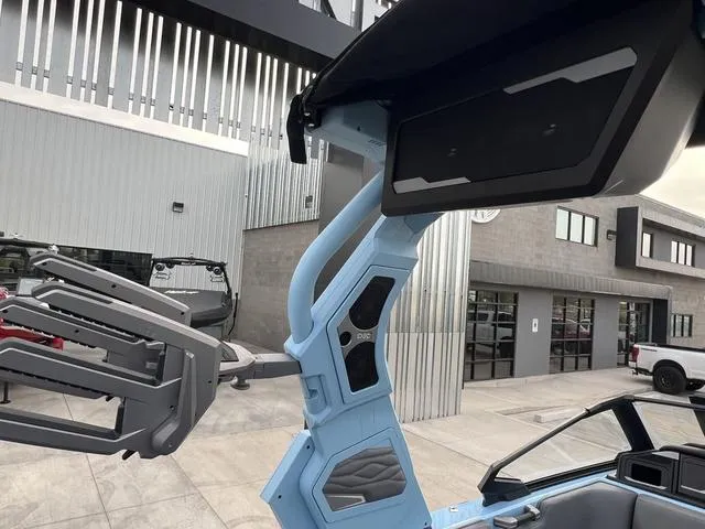 Slide: The Image of 2025 Supra SE 575 boat with modern design and advanced features in a sleek urban setting. - 15