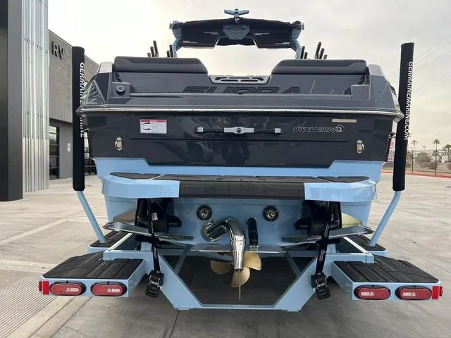 Slide: The Image of 2025 Supra SE 575 boat rear view, showcasing sleek design and advanced features. - 7