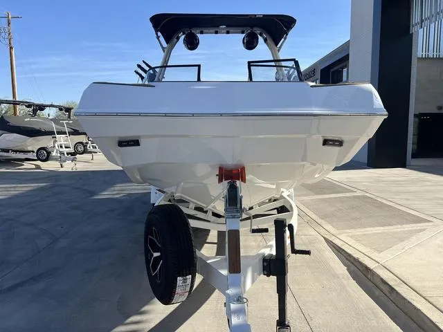 Slide: The Image of 2025 Moomba Max boat on trailer, parked outdoors, front view. - 3