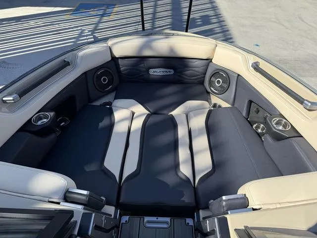 Slide: The Image of Luxurious interior of 2025 Supra SL 400 boat with premium seating and speakers. - 10