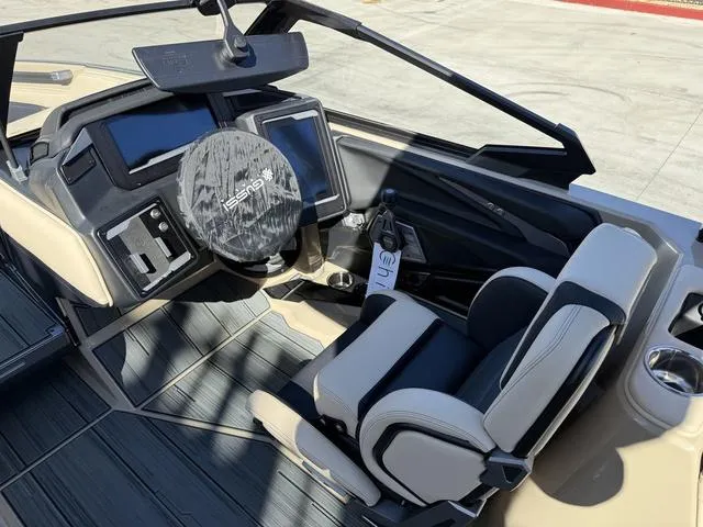 Slide: The Image of 2025 Supra SL 400 boat cockpit with modern controls and seating. - 11
