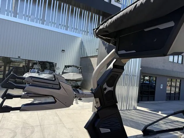 Slide: The Image of 2025 Supra SL 400 boats displayed at a modern dealership. - 13