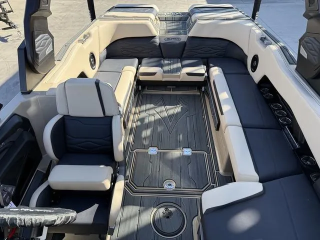 Slide: The Image of 2025 Supra SL 400 boat interior with luxurious seating and modern design. - 8