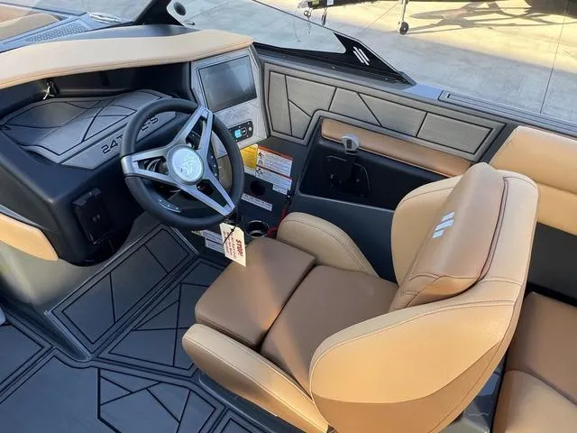 Slide: The Image of 2025 ATX Boats 24 TYPE-S interior with tan seats and modern dashboard. - 12
