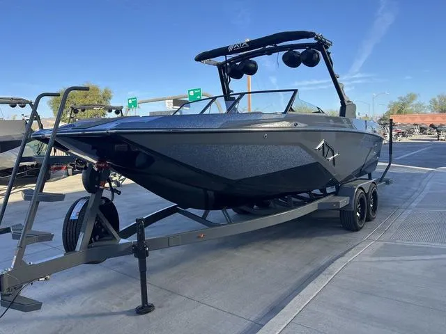 Slide: The Image of 2025 ATX Boats 24 TYPE-S on trailer, sleek design, parked outdoors. - 4