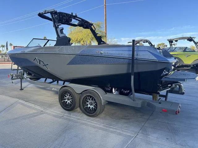 Slide: The Image of 2025 ATX Boats 24 TYPE-S on trailer, sleek design, parked outdoors. - 6