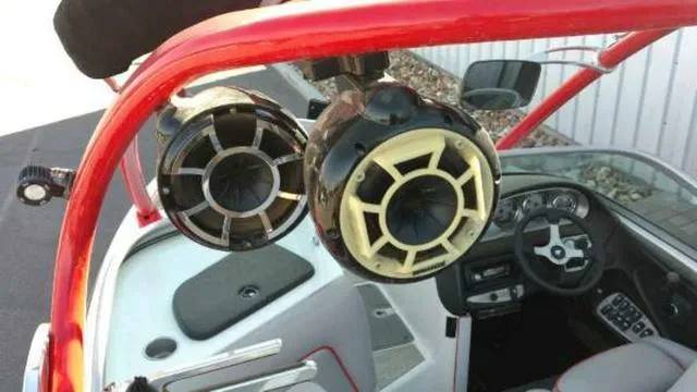 Slide: The Image of 2009 Centurion Elite V C4 Air Warrior boat with tower speakers and red frame. - 14