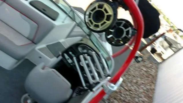 Slide: The Image of 2009 Centurion Elite V C4 Air Warrior boat interior with red accents and audio system. - 15