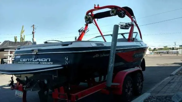 Slide: The Image of 2009 Centurion Elite V C4 Air Warrior boat on trailer, parked outdoors. - 5
