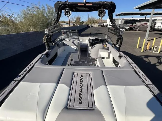 Slide: The Image of 2023 Moomba Max boat interior with seating and wakeboard tower. - 10