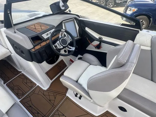 Slide: The Image of 2020 Tigé 25ZX boat interior with modern dashboard and steering wheel design. - 10