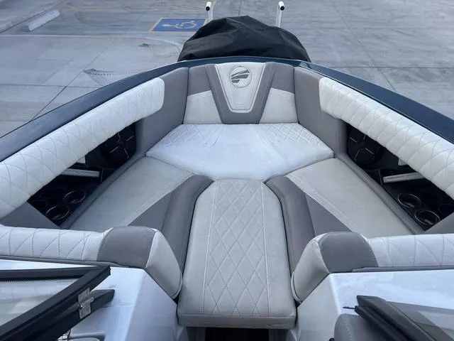 Slide: The Image of 2020 Tigé 25ZX boat interior with luxurious gray and white seating. - 11